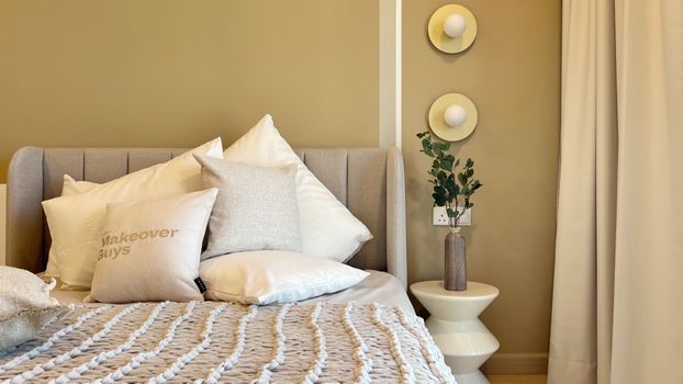 A modern bedroom featuring a comfortable bed and elegant interior design elements, perfect for a cozy ambience.