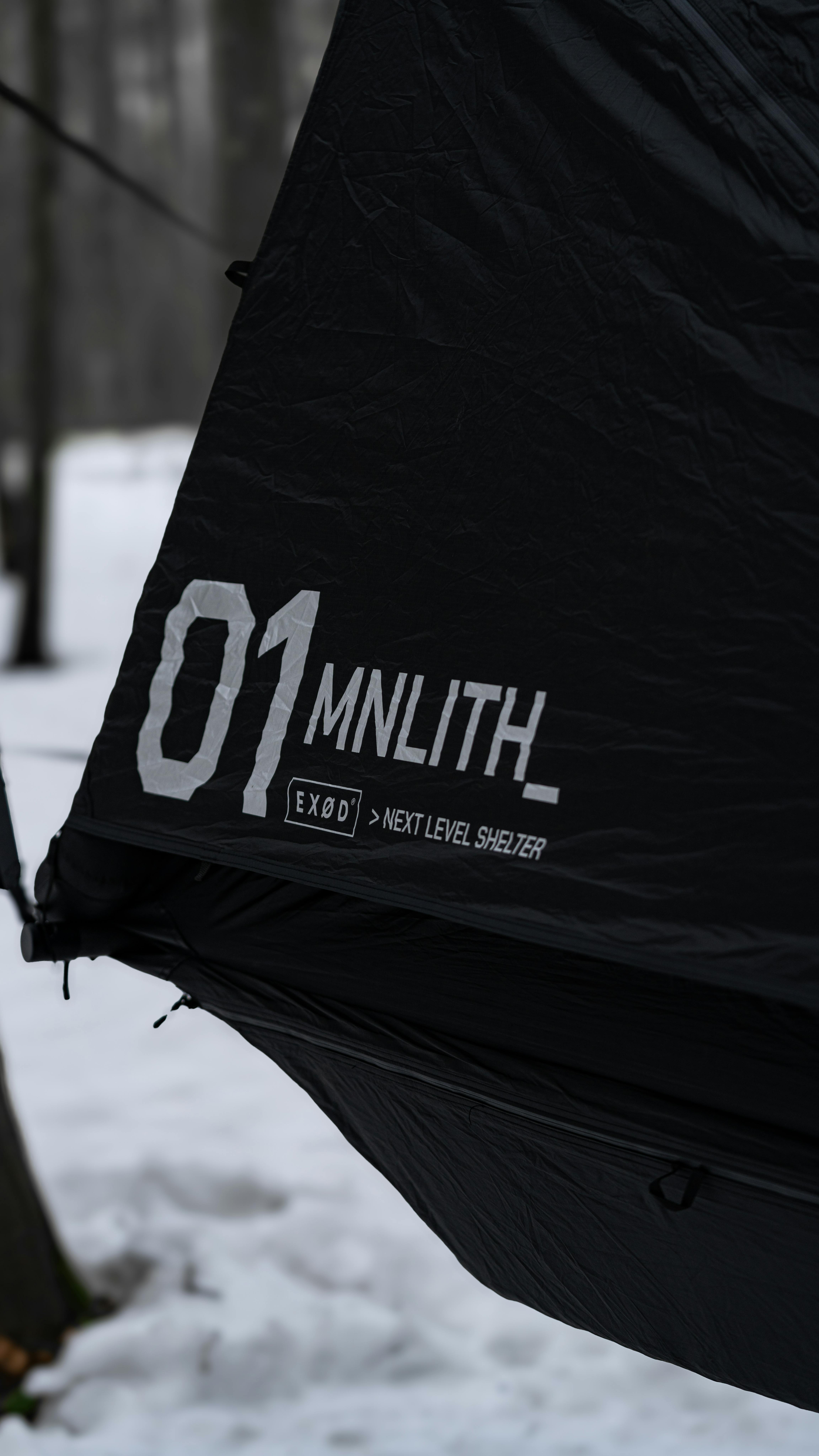 Four-season tent pitched in snowy alpine terrain