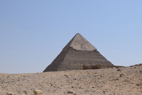 Free View of the Pyramid of Menkaure under a clear blue sky in Cairo, Egypt. Stock Photo