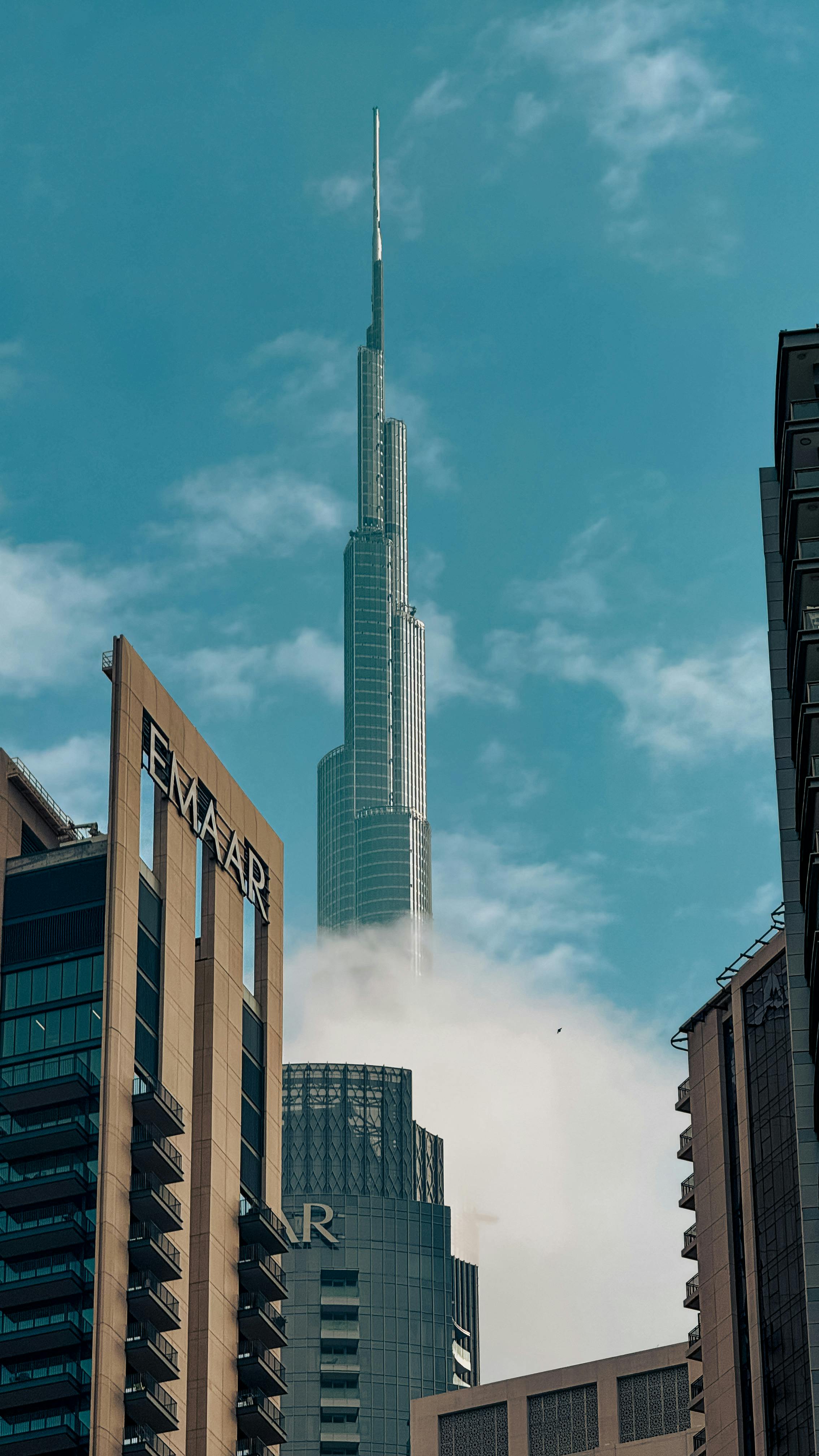 Captivating cityscape showcasing the majestic Burj Khalifa towering above the Dubai skyline on a clear day.