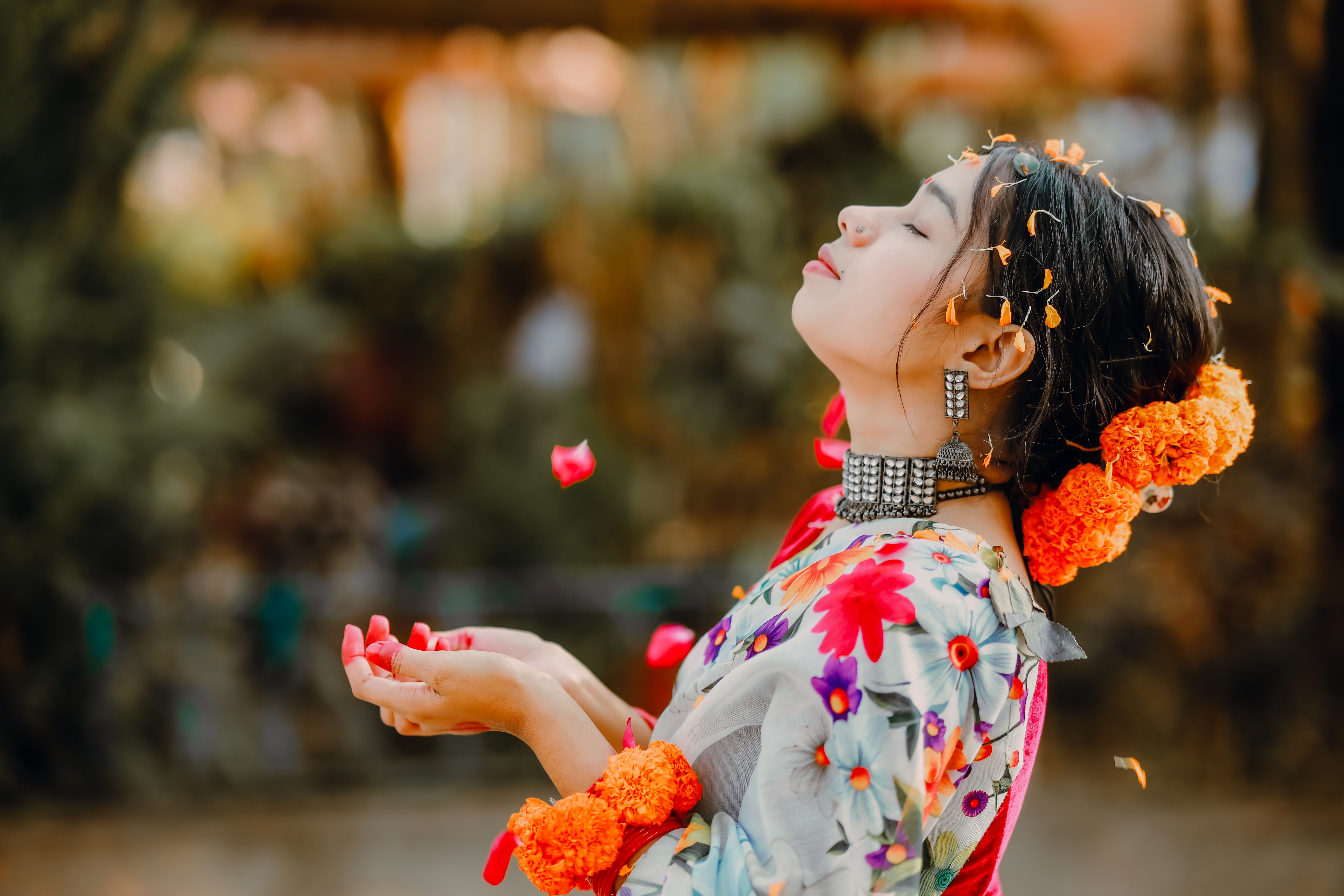 Joyful Woman in Colorful Traditional Dress with Flowers · Free Stock Photo