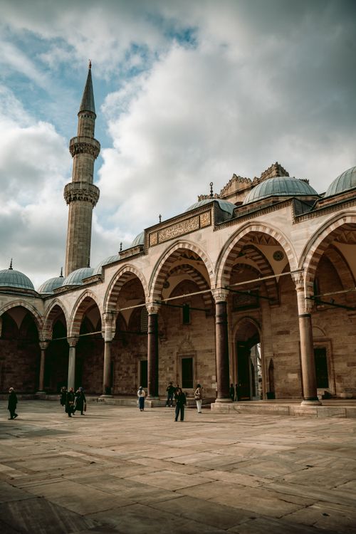 Free Historic archway and minaret view at Süleymaniye Mosque's courtyard in Istanbul, Turkey. Stock Photo