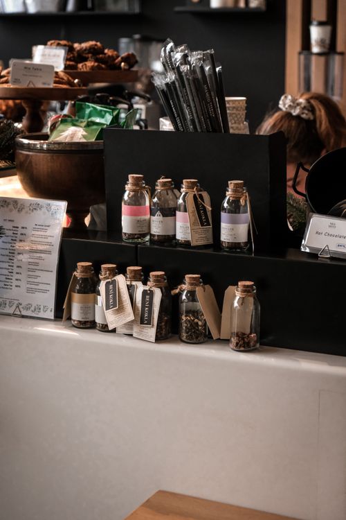 Free Charming cafe scene in Ankara featuring jars of herbs and a display of pastries. Stock Photo