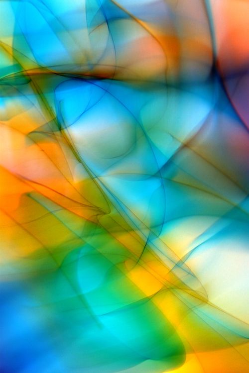 Free Dynamic abstract image featuring vivid swirling colors in a vibrant light pattern. Stock Photo