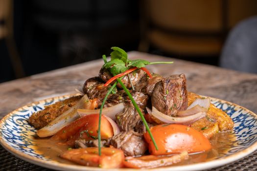 Close-up of a savory Peruvian Lomo Saltado, showcasing vibrant colors and fresh ingredients.