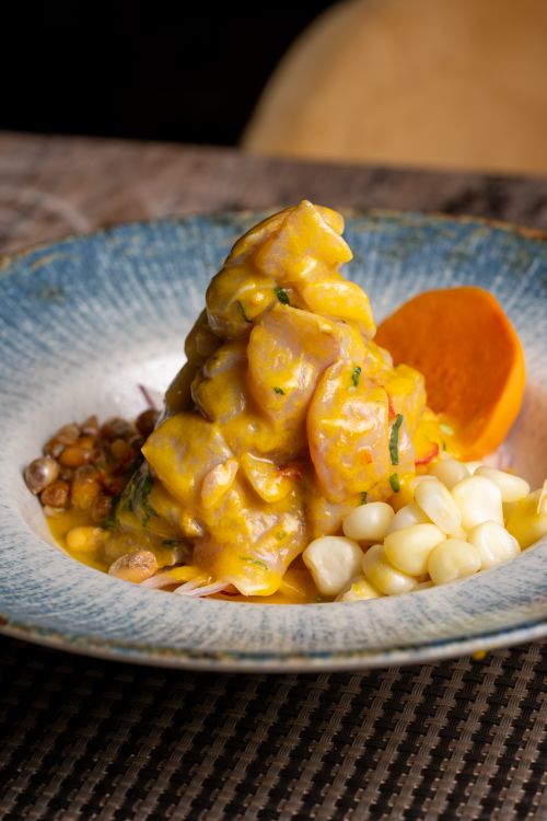 Free Appetizing Peruvian ceviche served with sweet potato and corn. Stock Photo