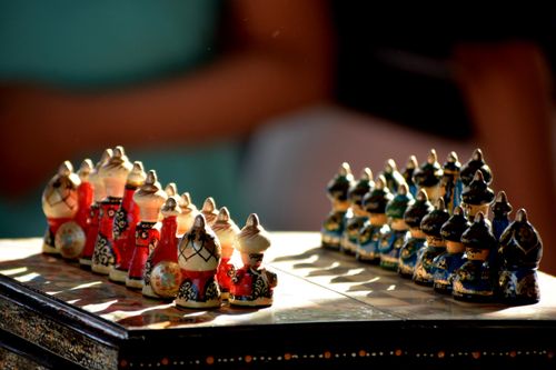 Free A beautifully crafted chess set displayed at an Indian craft fair, showcasing cultural artistry. Stock Photo