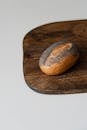 Poppy Seed Bread Roll on Wooden Board