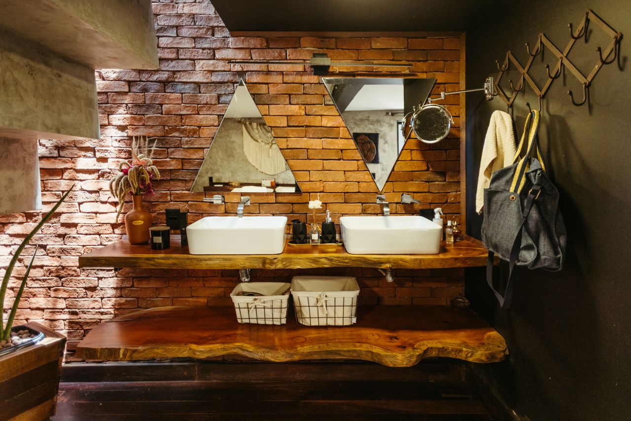 industrial-open-shelving-vanity Industrial bathroom with open wood shelving and vessel sinks