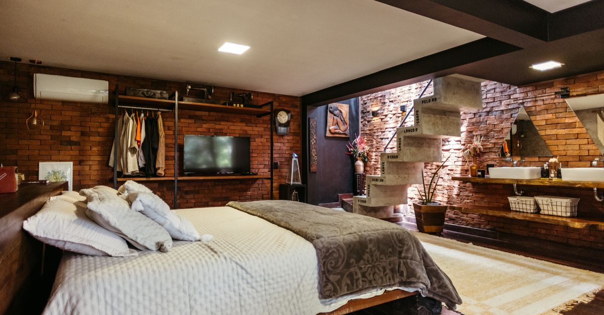Stylish bedroom interior with unique staircase in Santa Teresa, Brazil.