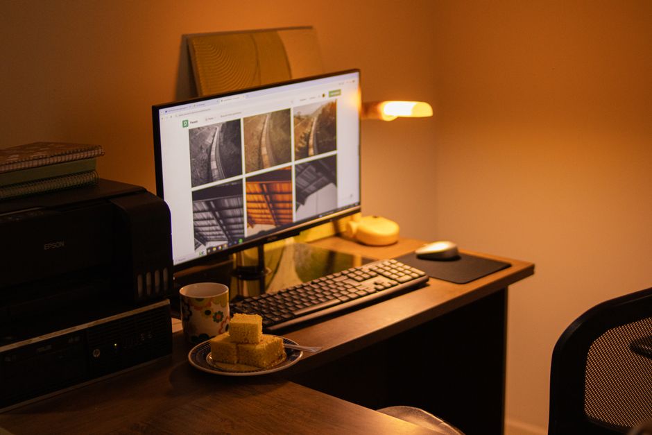 Does Pre-Workout Actually Boost Performance? Science-Based Review Warm-toned home office with computer setup, snacks, and ambient lighting.