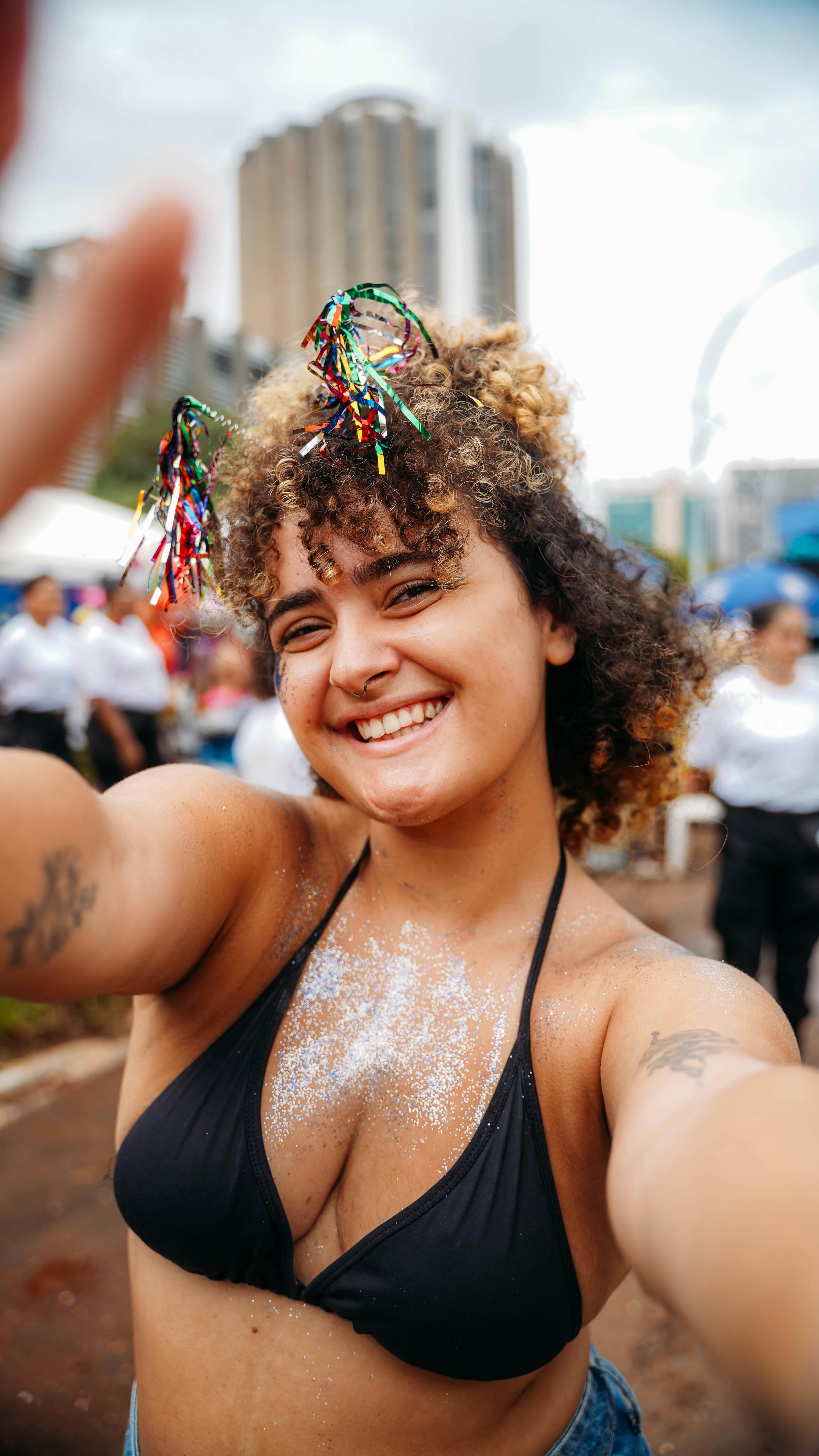 joyful woman celebrating outdoors in summer