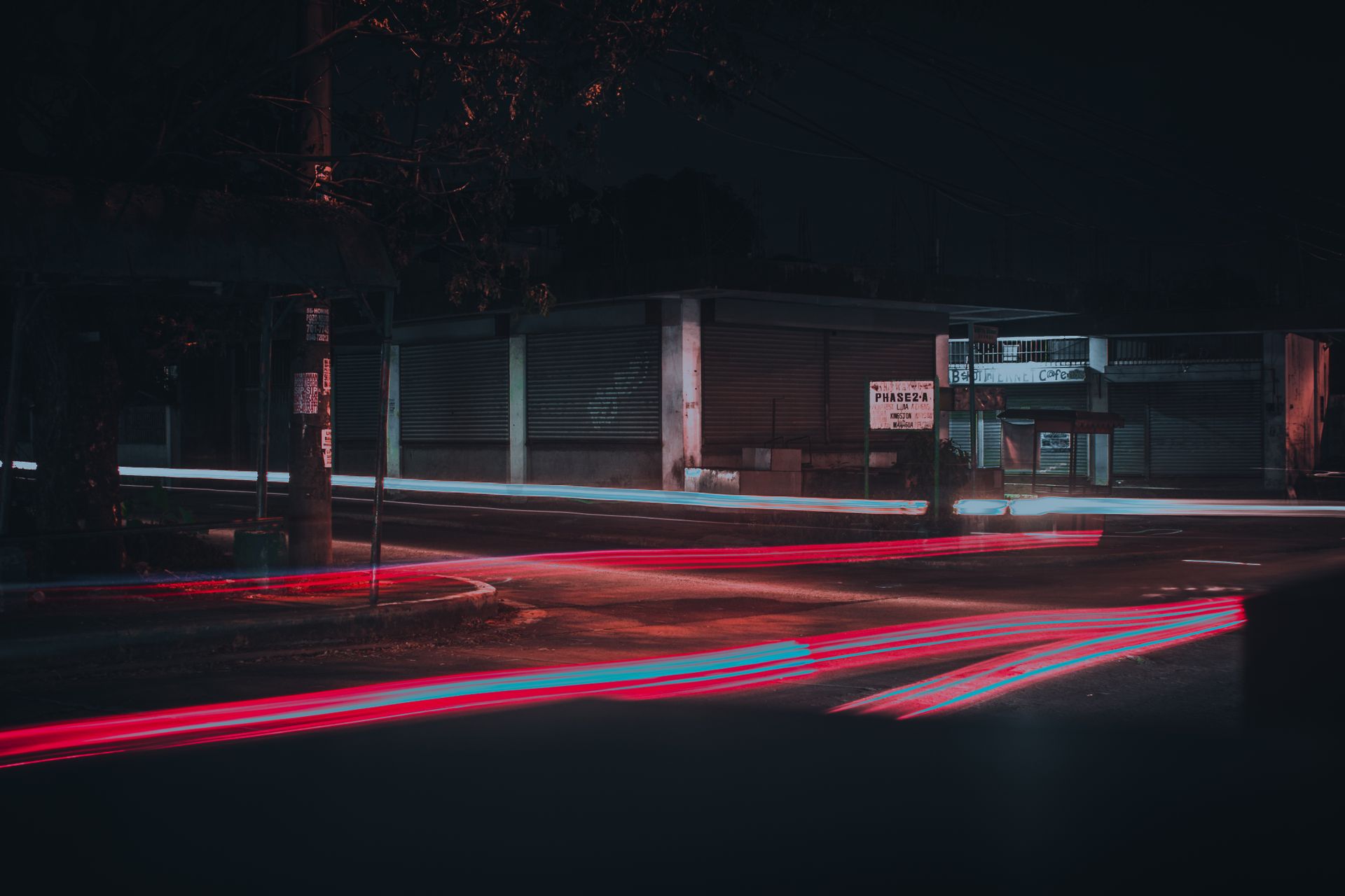 A captivating night street scene featuring light streaks captured with long exposure photography.