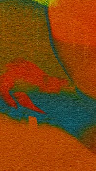 Vibrant abstract expressionism with a mix of orange, blue, and green textures.