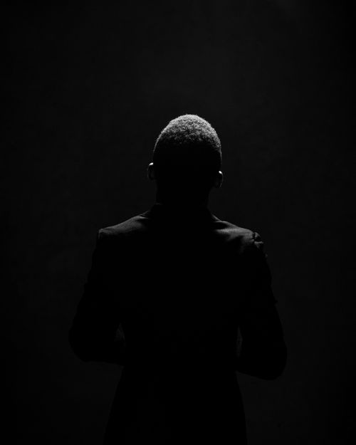 Free Dramatic silhouette portrait of a man in Abuja, capturing mystery and texture. Stock Photo
