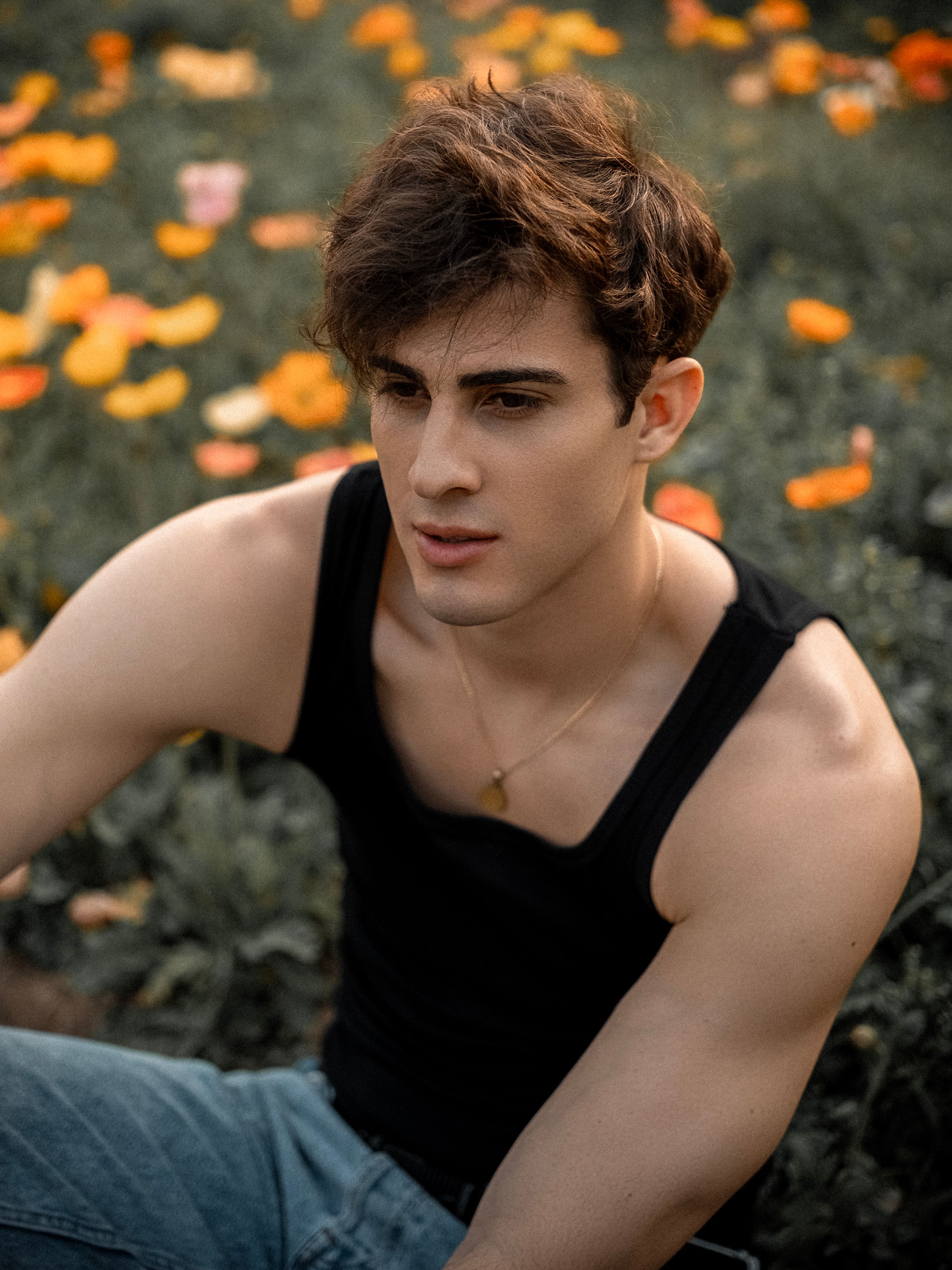 Young Man in Nature Portrait with Flowers · Free Stock Photo