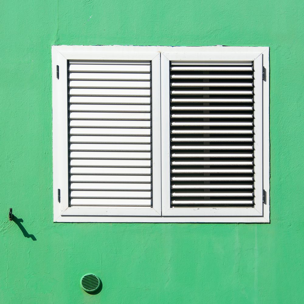 uPVC Spraying in Berry's Green — clean edges cut in around trim and sockets