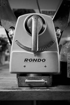 Close-up black and white photo of vintage Rondo kitchen equipment, showcasing industrial design.