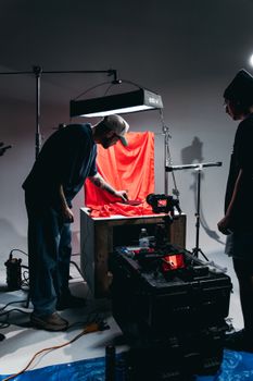 Professional film setup with crew, lighting, and camera equipment in Orlando studio.