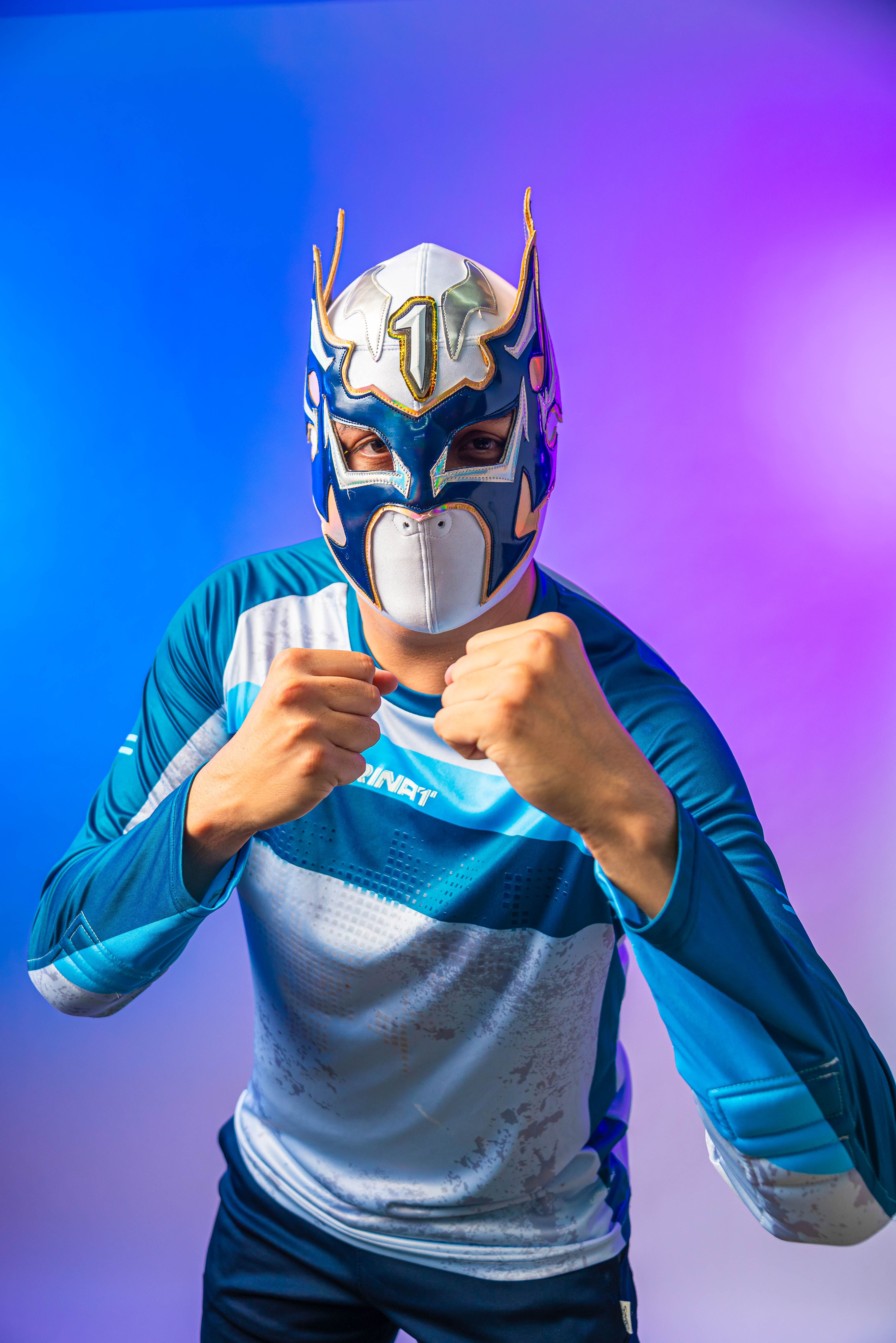 Masked Wrestler in Vibrant Colors Posing Confidently · Free Stock Photo