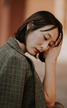 Serene portrait of a woman in León, México, showcasing reflective mood.