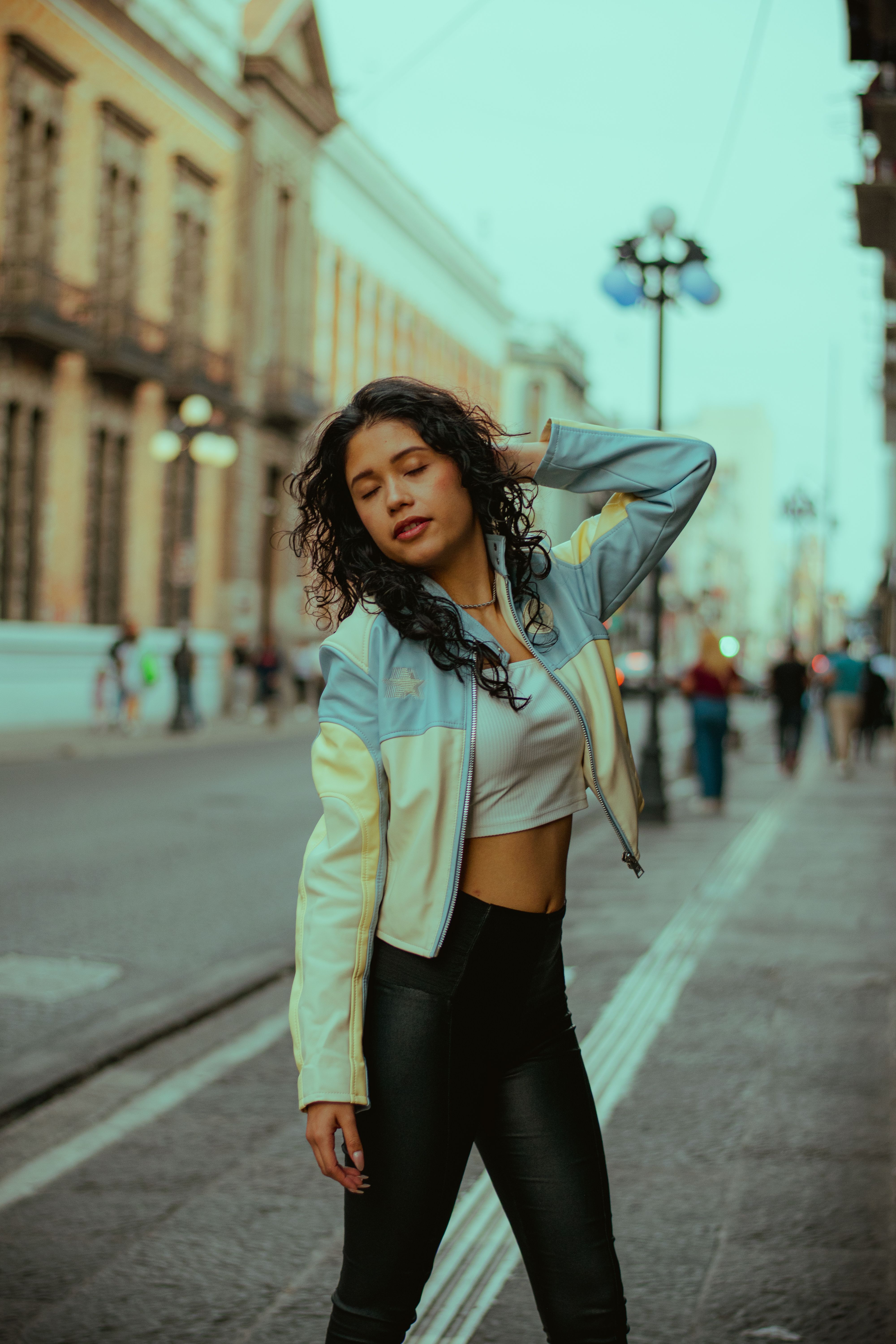 Fashionable woman posing in urban street setting · Free Stock Photo