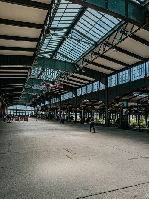 Free Spacious train station with vintage design and glass skylight roof. Stock Photo