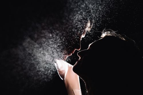 Free Moody silhouette of a couple in love with dramatic lighting and mist effect. Stock Photo