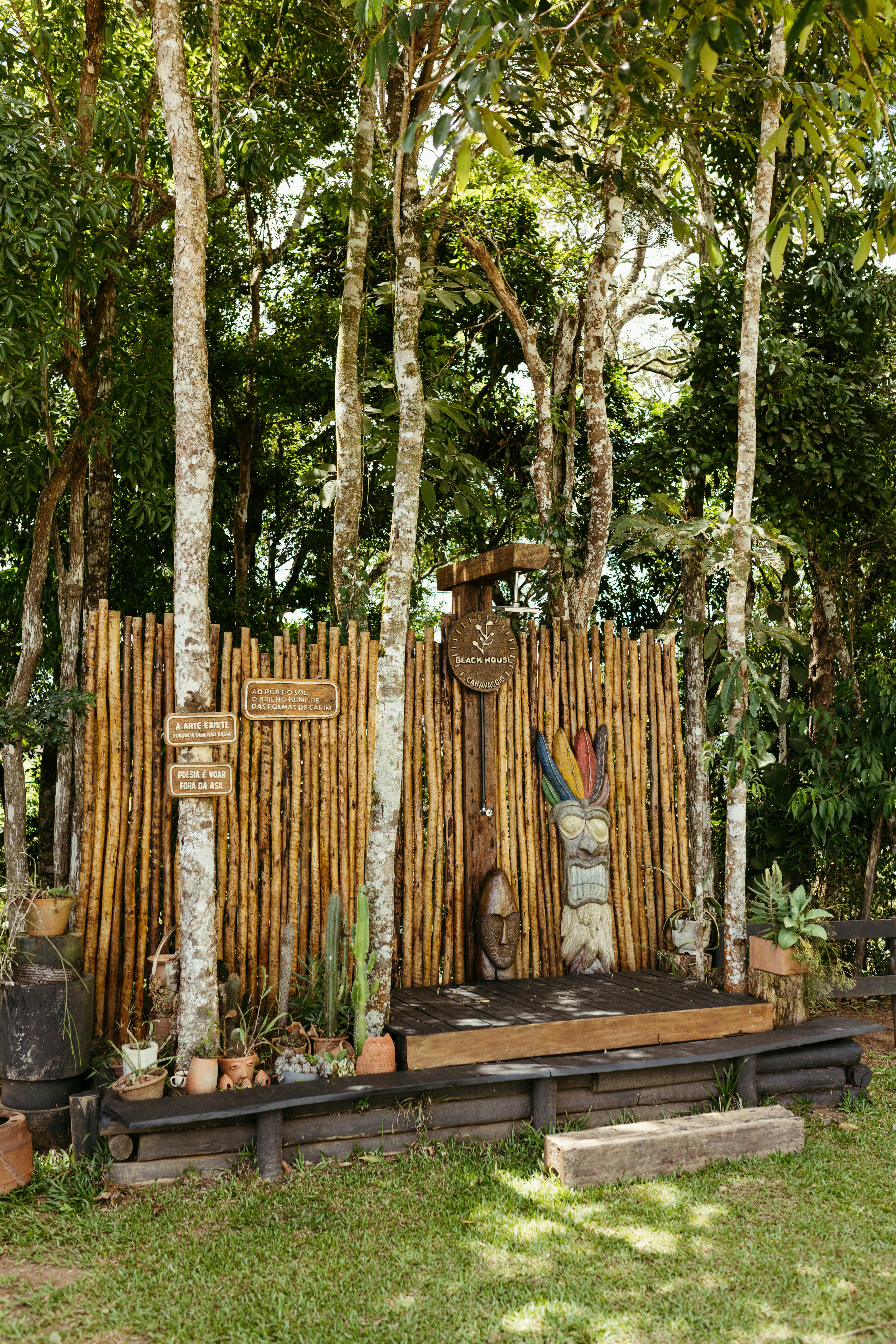 rustic garden scene with wood carvings in brazil
