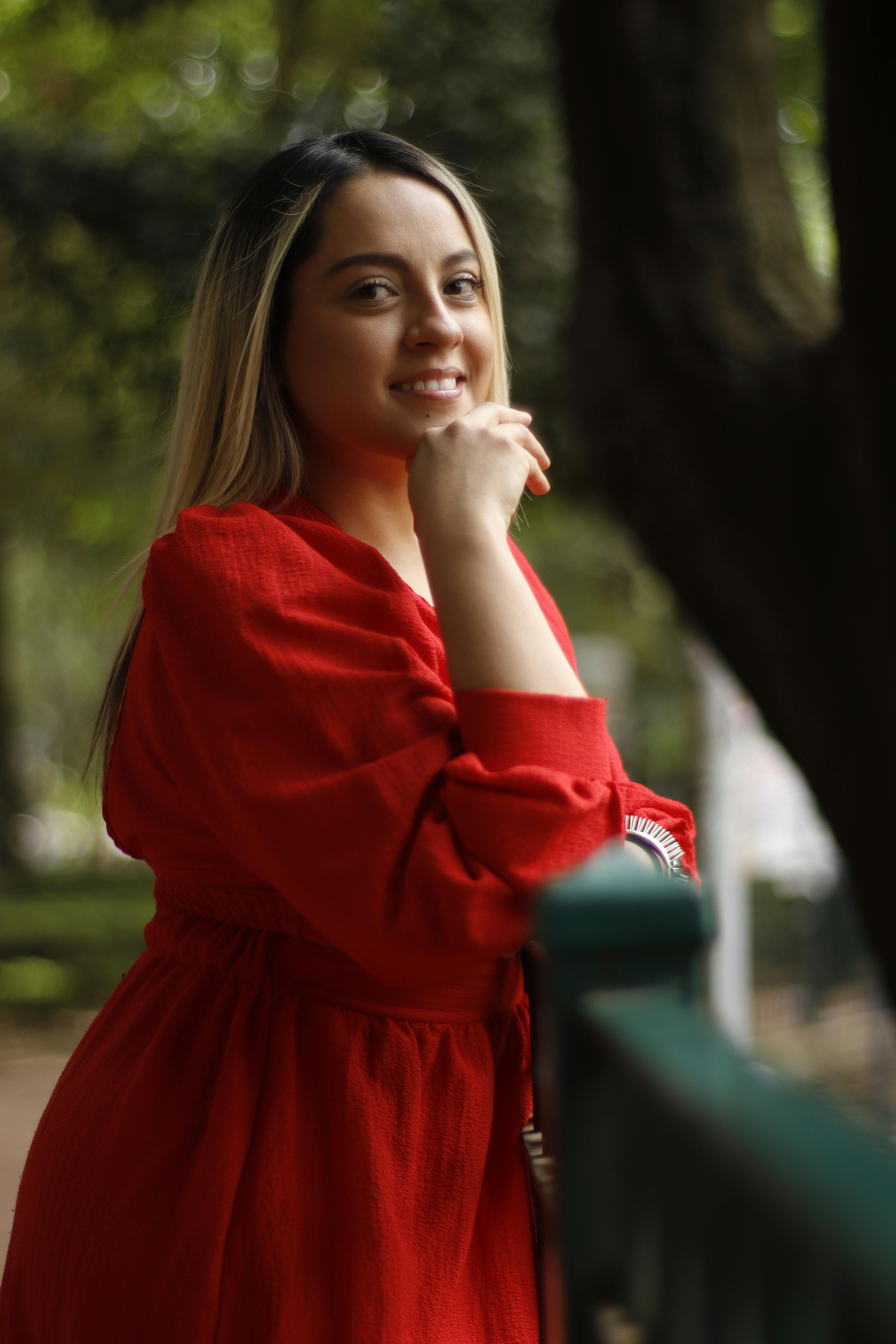 woman in red dress relaxing in nature