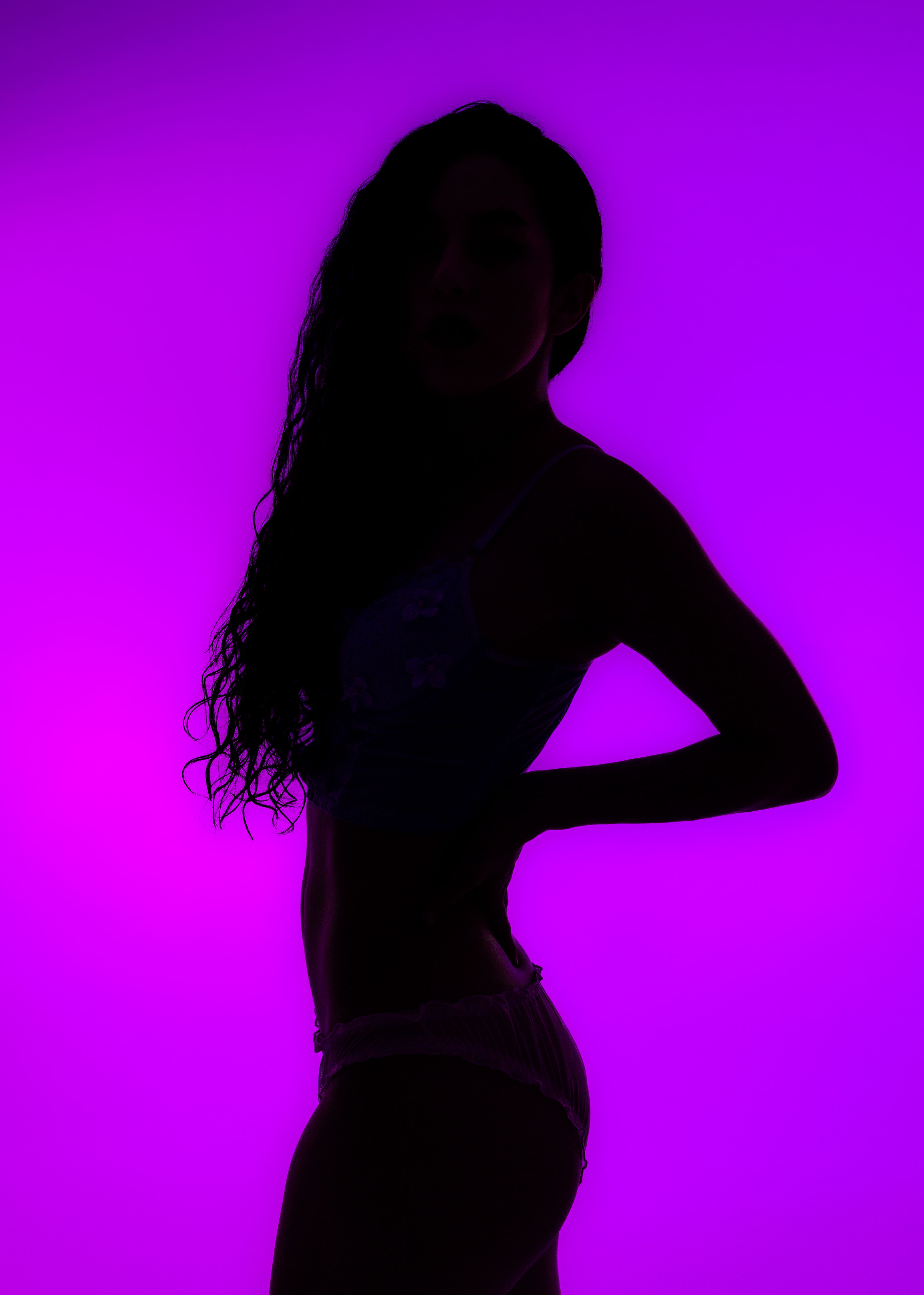 Silhouette of Woman Against Purple Background · Free Stock Photo