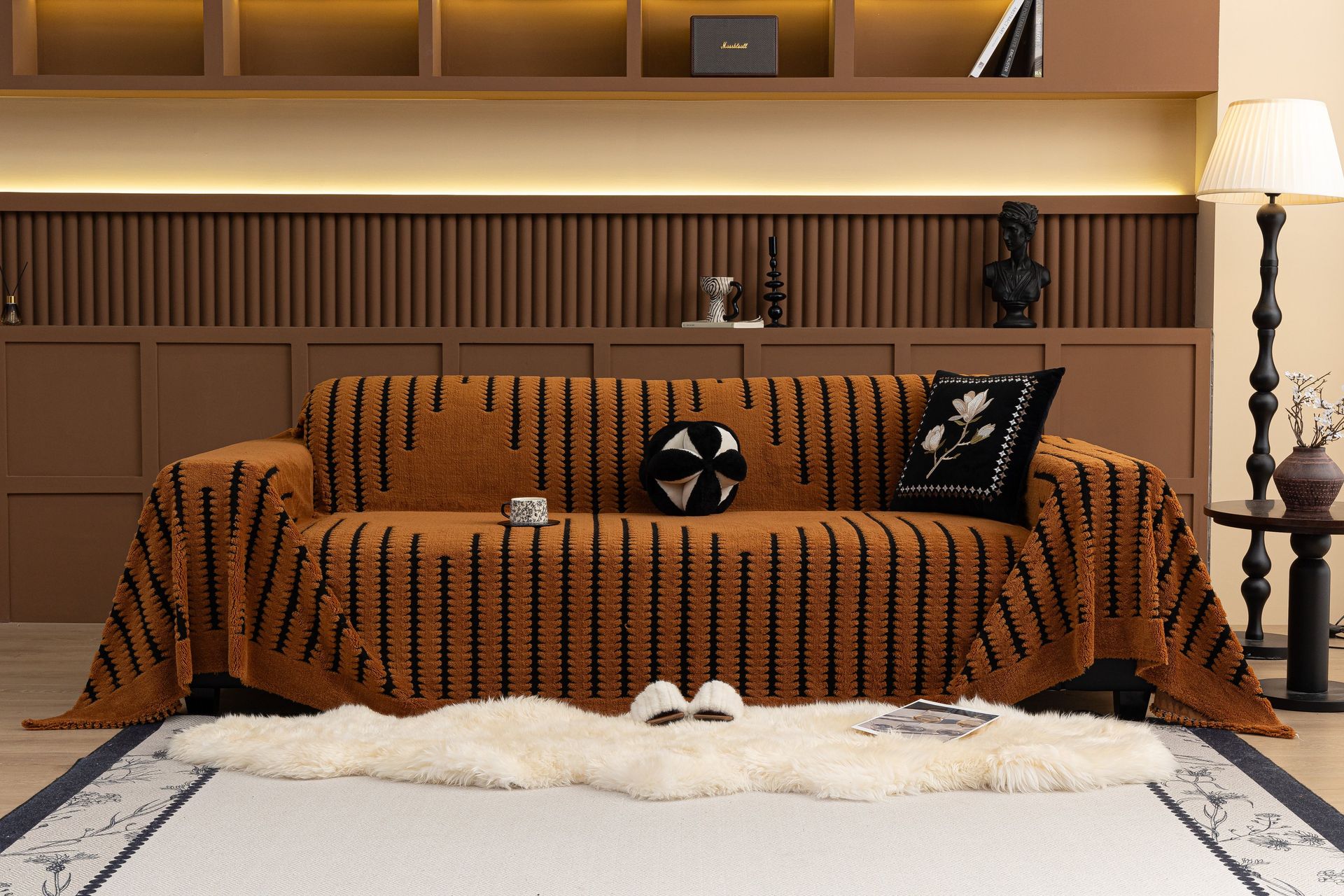 Elegant living room featuring a modern geometric sofa cover and cozy decor.
