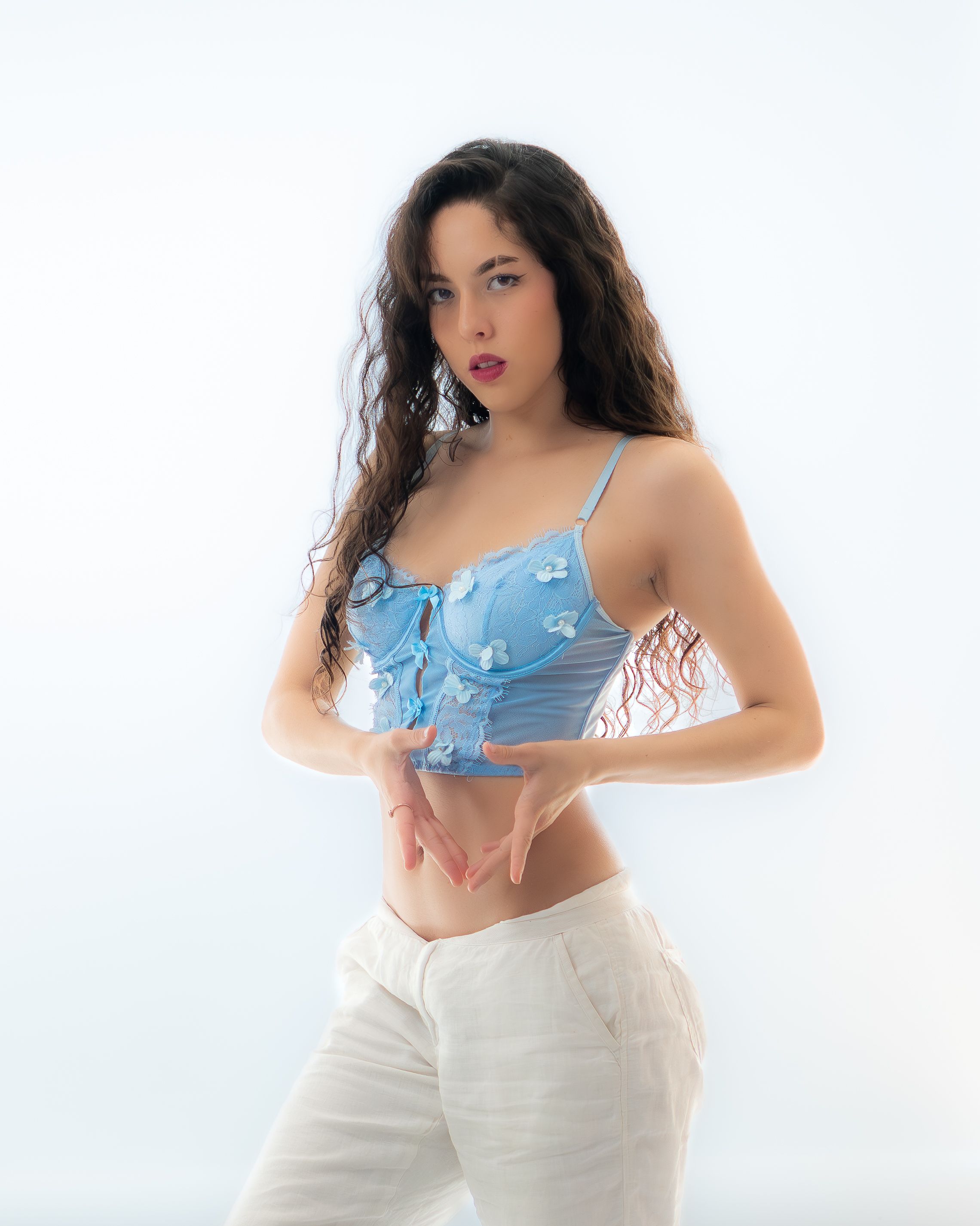 Fashion model posing against a white studio background