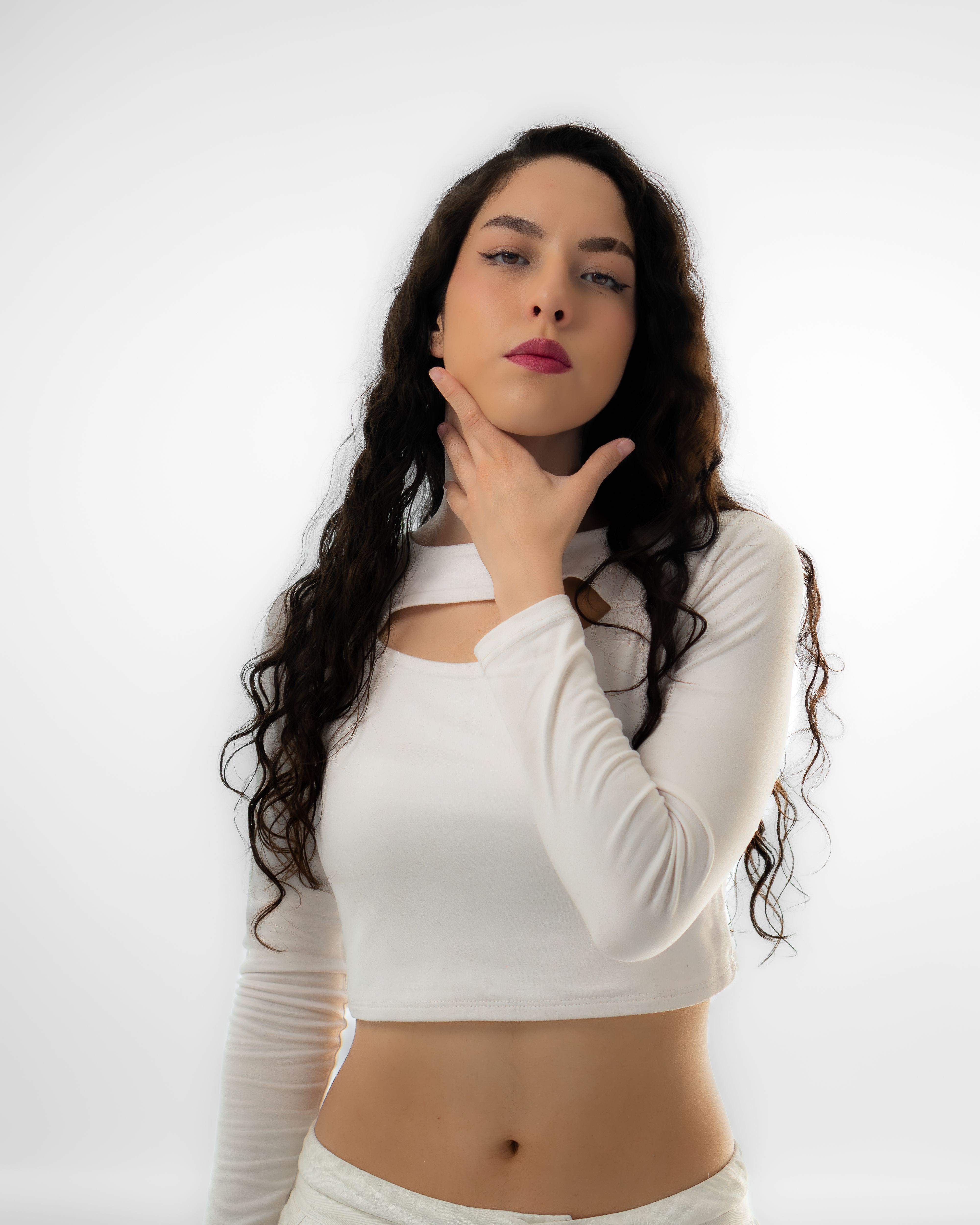 Elegant Portrait of a Woman in White Attire · Free Stock Photo