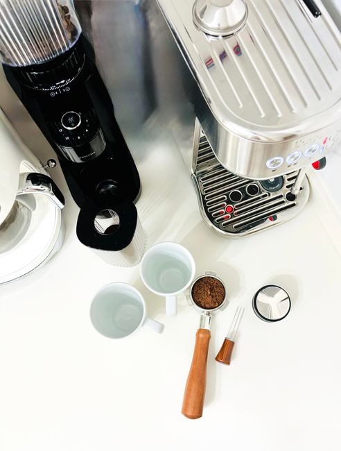 home espresso machine and grinder on kitchen counter