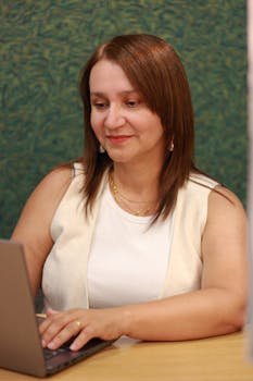 Professional woman focused on work in an office setting in Braga, Portugal.