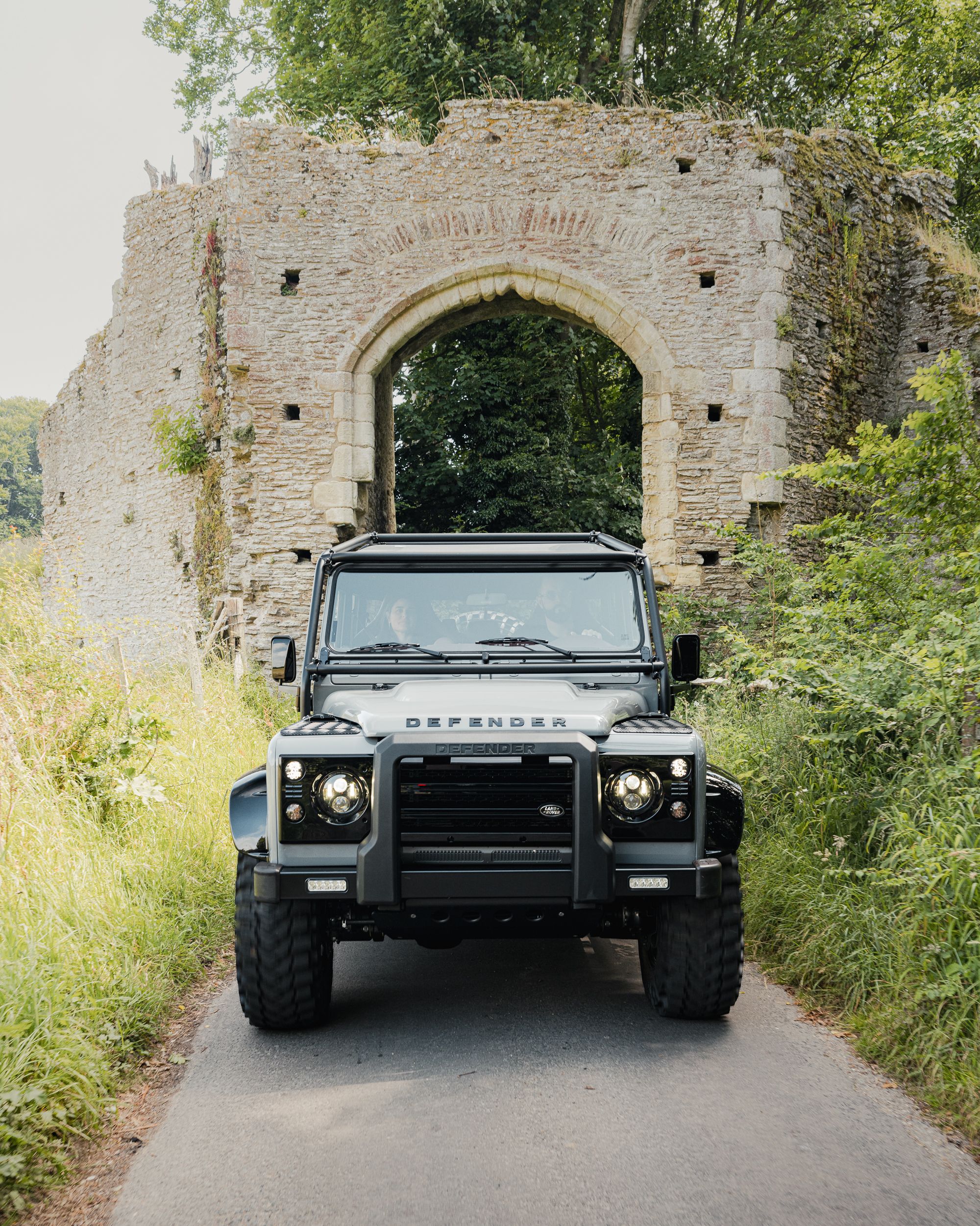 Land Rover Defender on Scenic Country Road · Free Stock Photo