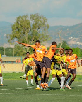 Vivid image of a heated soccer match with players in action on a sunny day.
