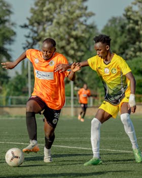 Action-packed soccer game featuring two players competing intensely on the field.