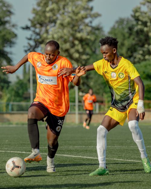 Free Action-packed soccer game featuring two players competing intensely on the field. Stock Photo