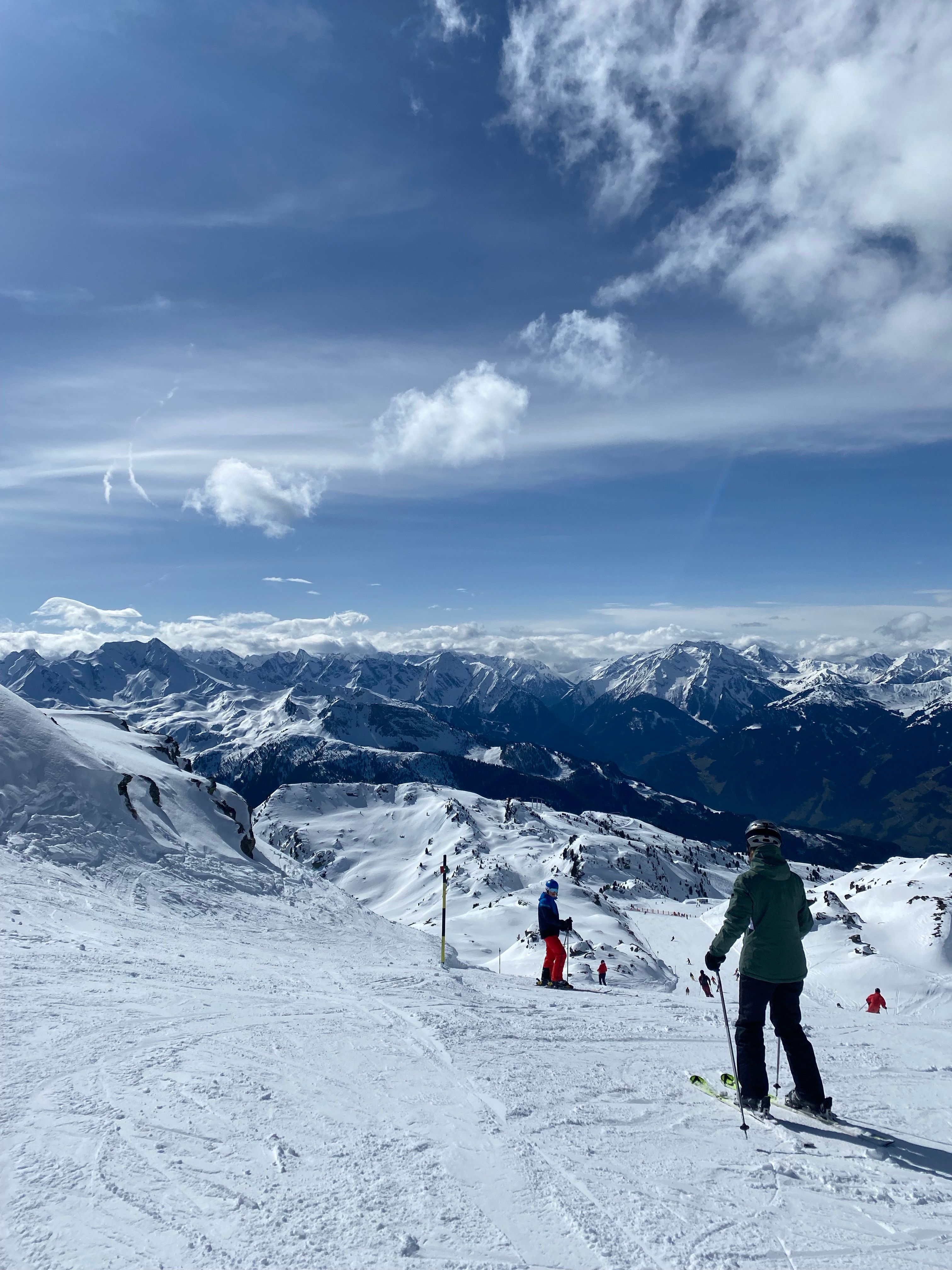 Skiers Enjoying a Sunny Day on Alpine Slopes · Free Stock Photo