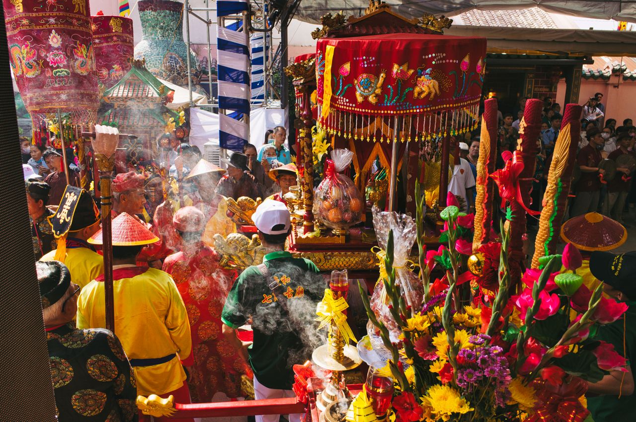colorful and vibrant asian festival with traditional clothing decorati