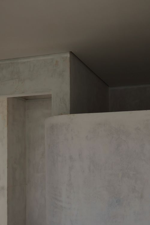 Sunlit wall and soft shadow — photo by Tiffany Christie Freeman on Pexels