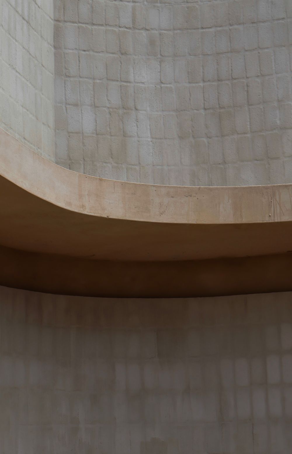 Curved sandstone wall and ceiling in warm light
