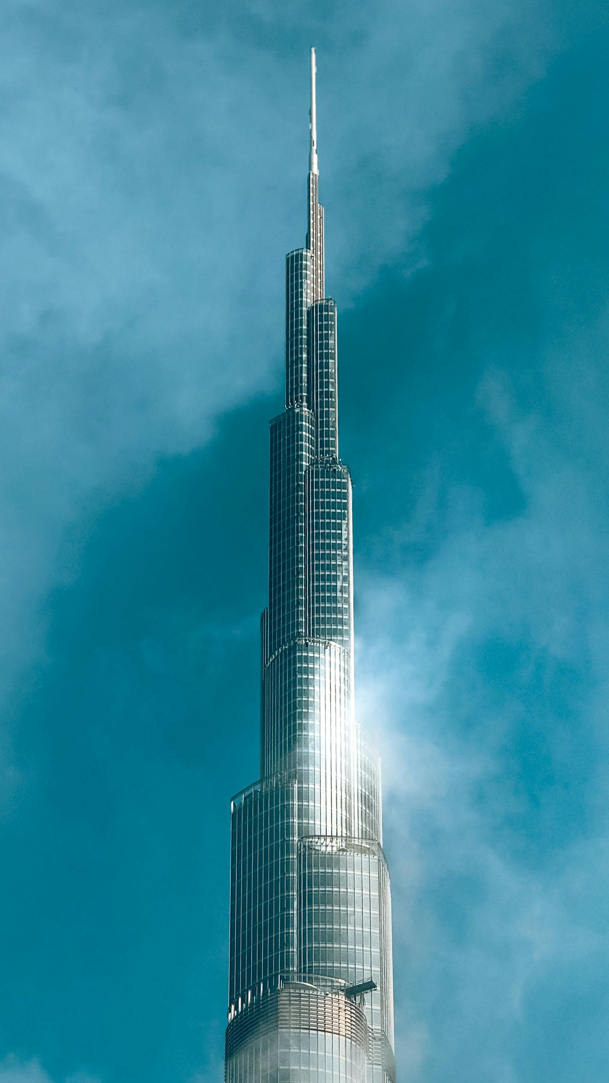 Iconic Burj Khalifa Tower Against Blue Sky · Free Stock Photo