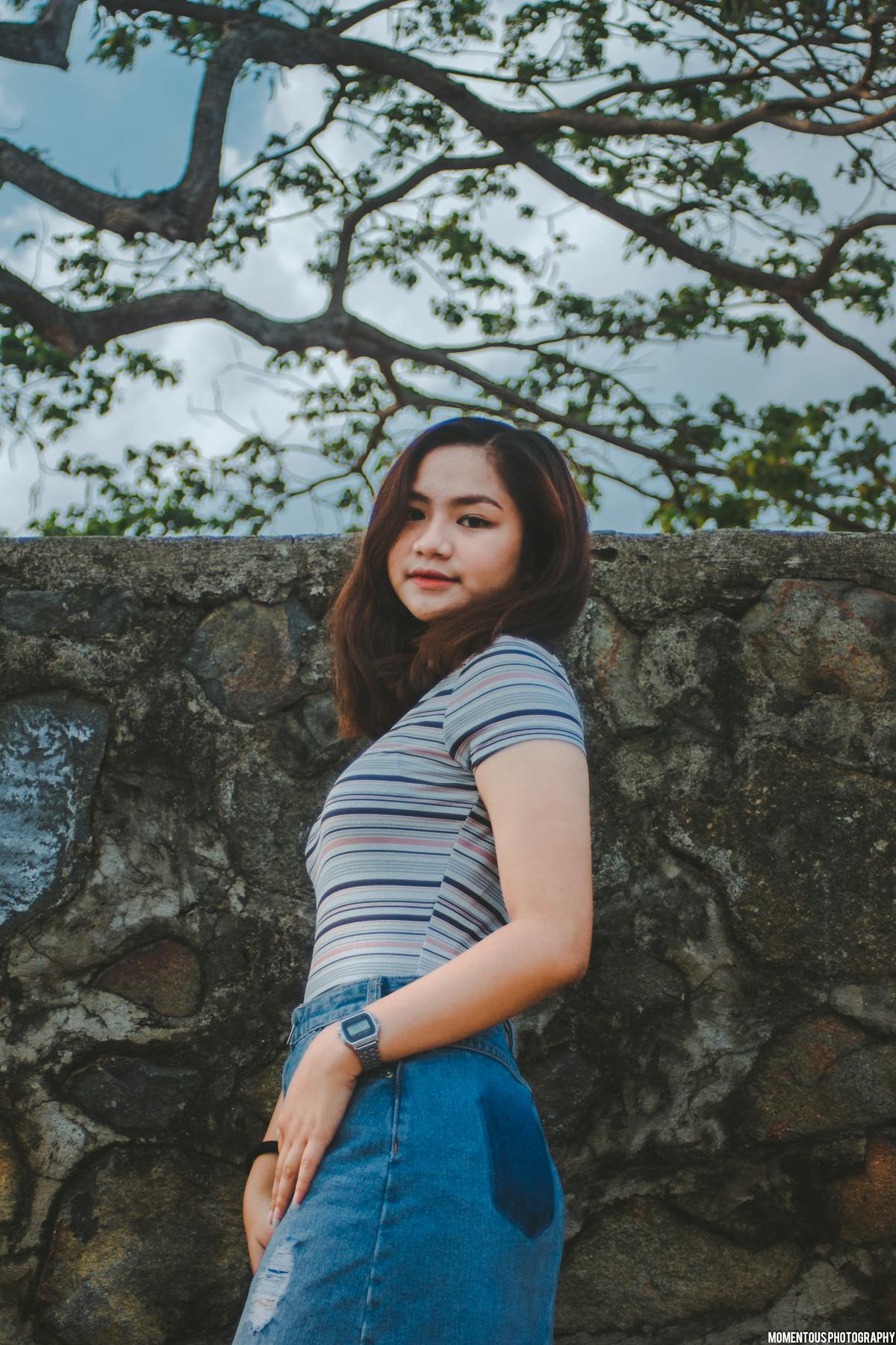 Traveler taking photo at beach with tripod