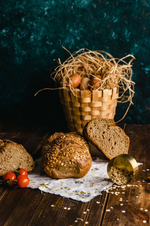 Free Artisan bread with eggs and tomatoes, perfect for rustic or homemade food themes. Stock Photo