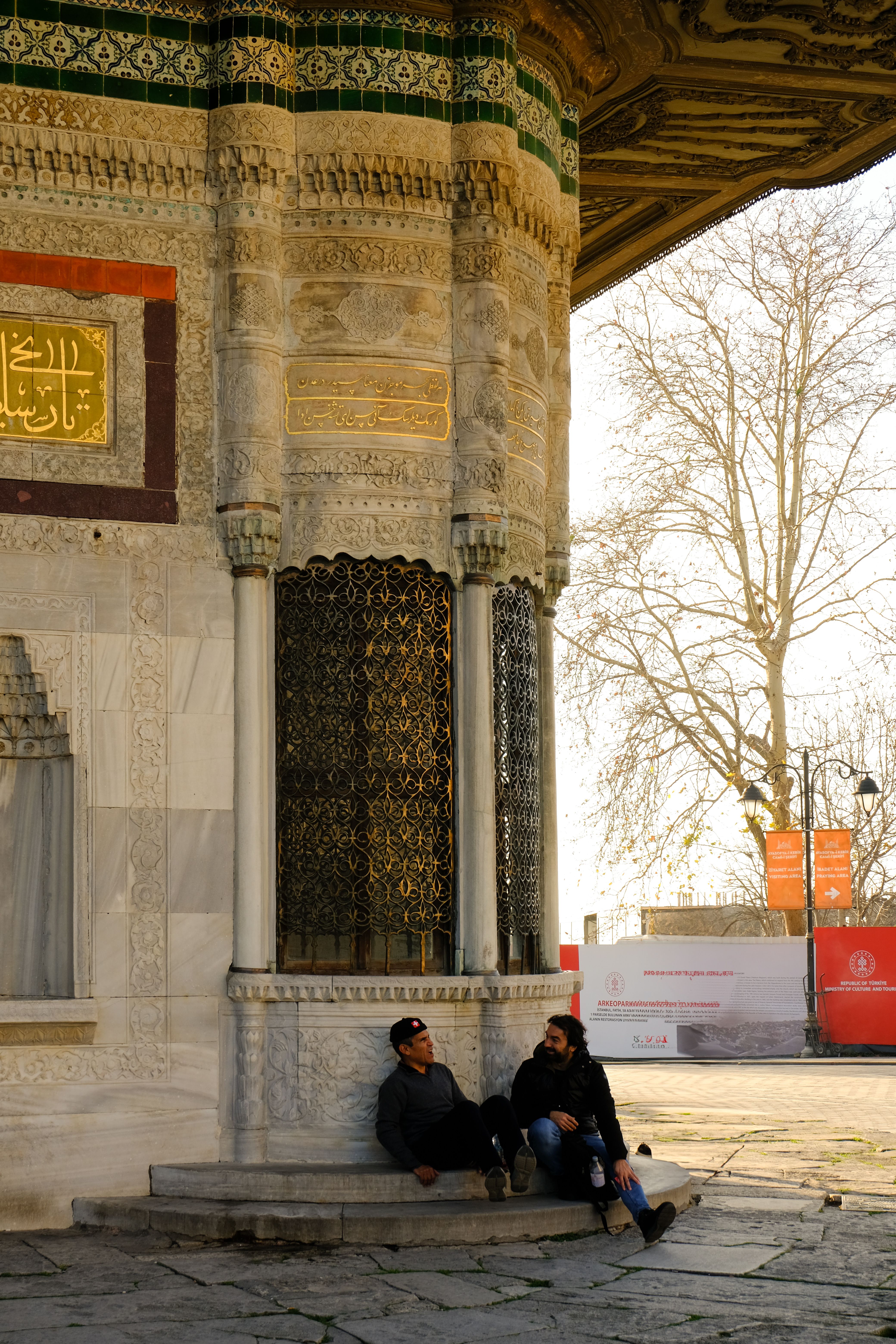 Men Relaxing by Historical Ottoman Architecture · Free Stock Photo