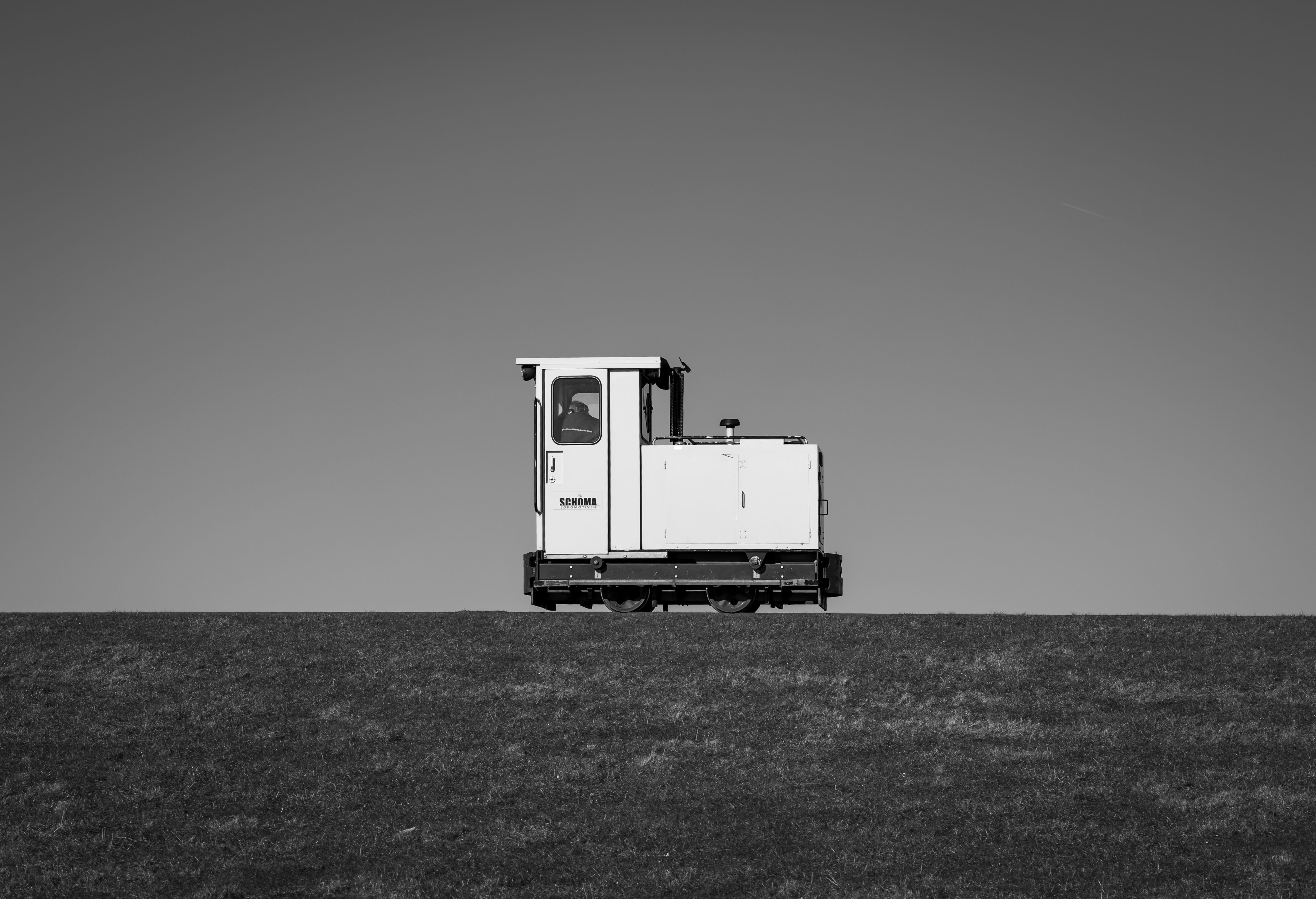 Single Vintage Train on Open Field Against Clear Sky · Free Stock Photo