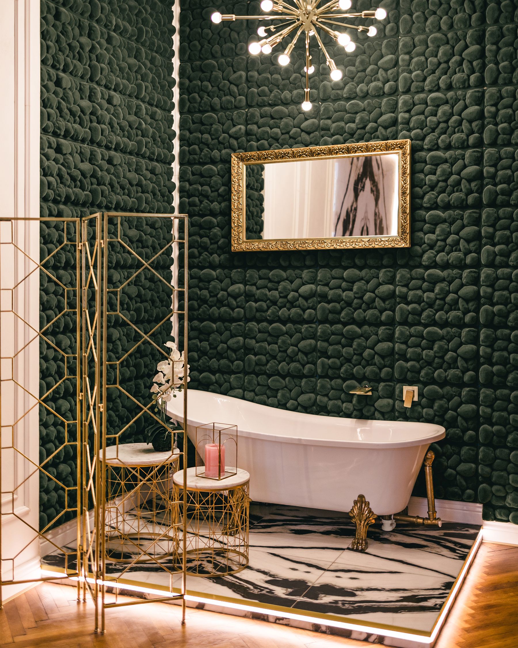 Vintage bathroom with clawfoot tub, gold-toned details and elegant classic styling